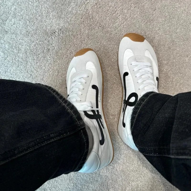 Puma White Sneakers with Black Logo and Gum Sole