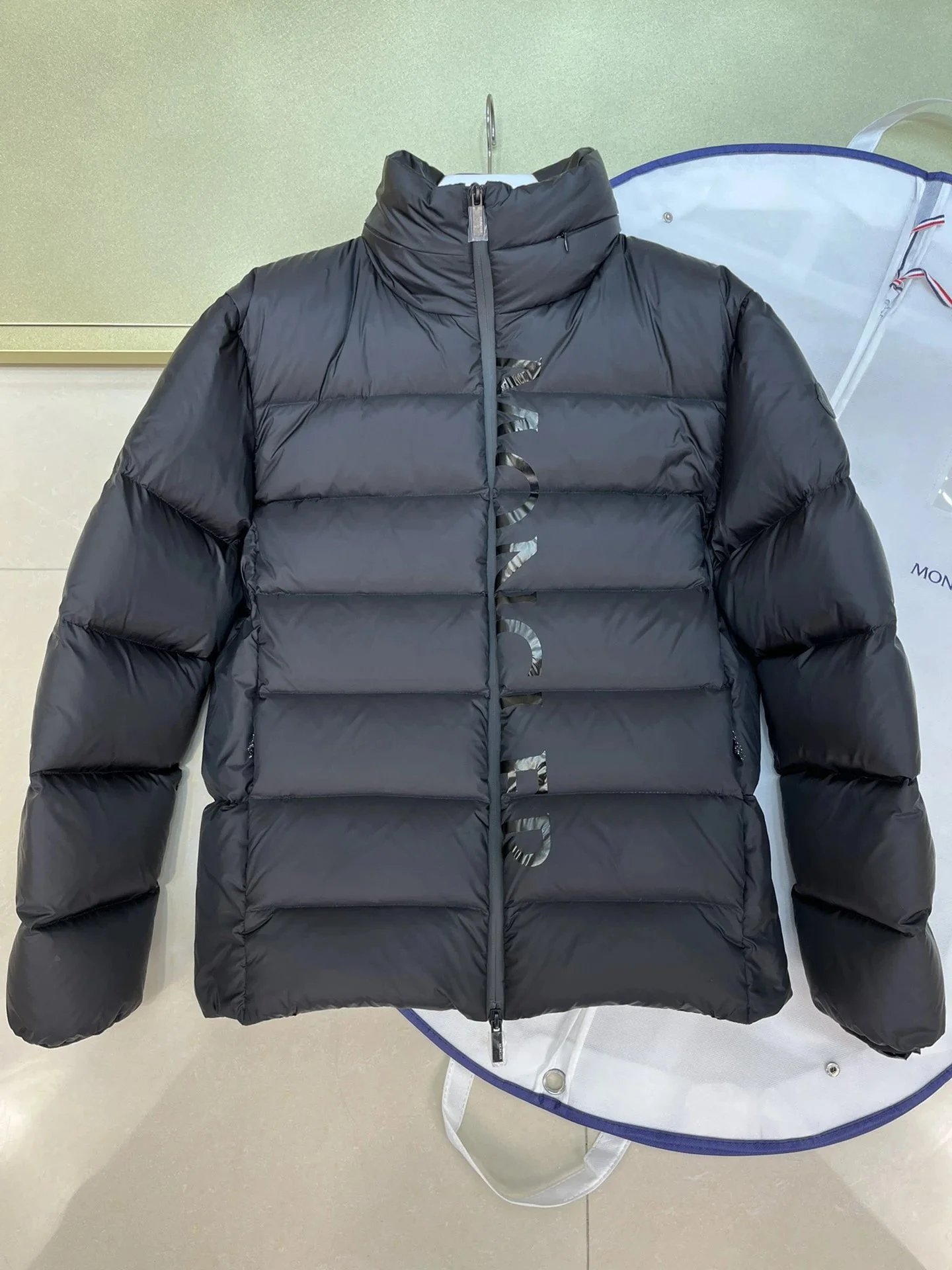 Moncler Black Down Jacket with Vertical Logo Design