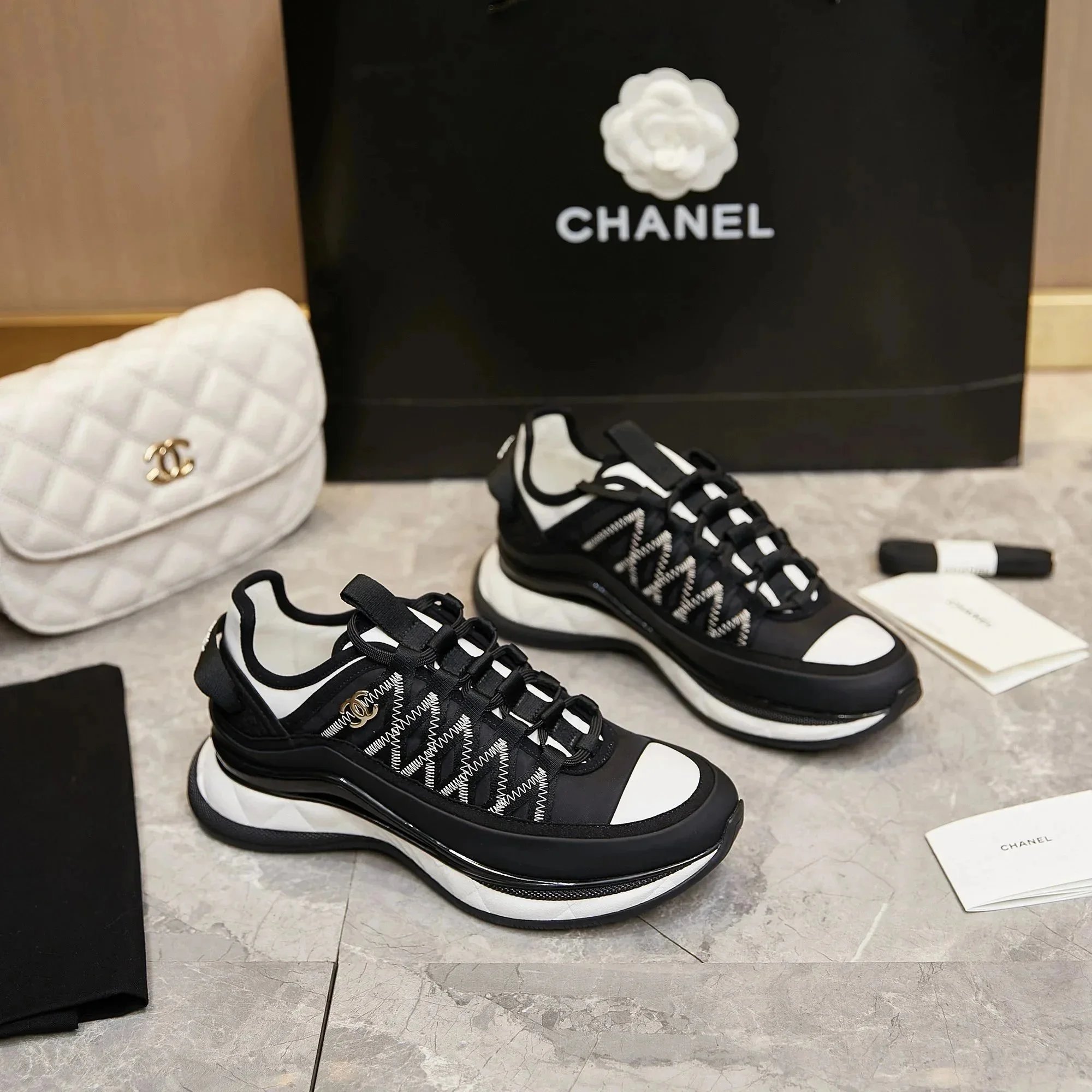 CHANEL Black and White Logo Sneakers with Chunky Sole