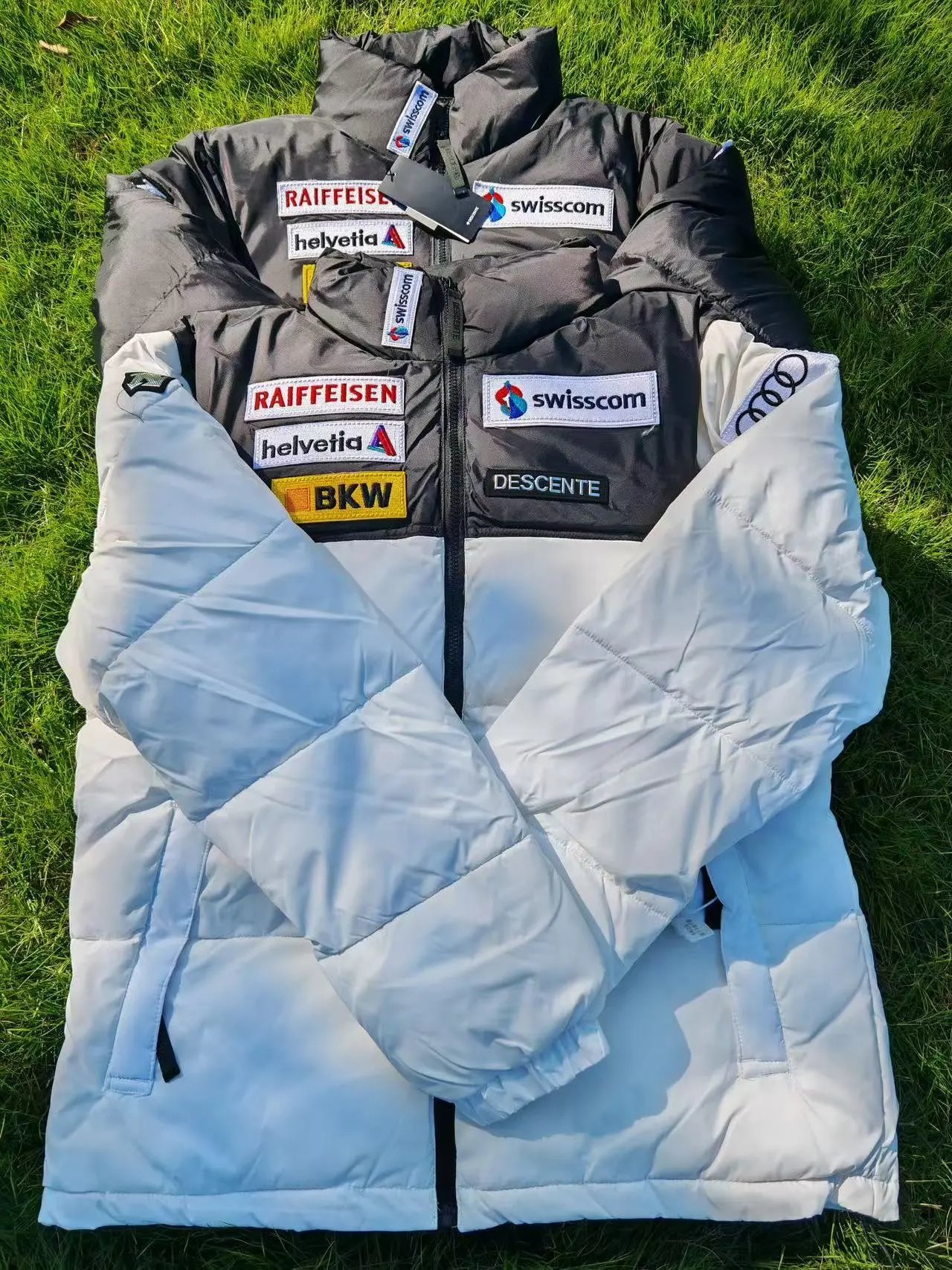 Descente Swiss Ski Team Down Jacket with Raiffeisen and Swisscom Logos