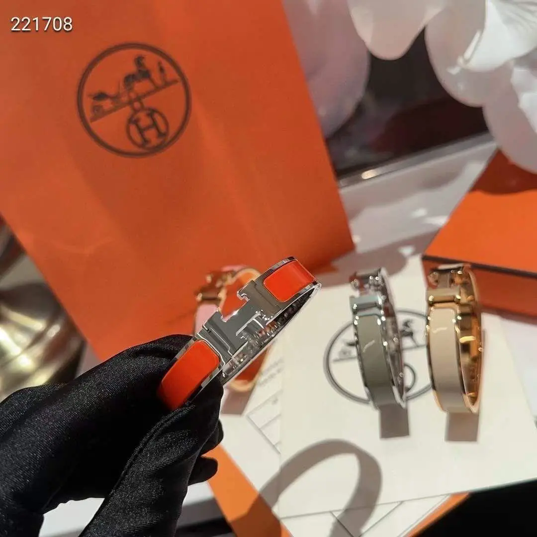 Hermès Clic H Bracelet Orange Enamel Silver Tone